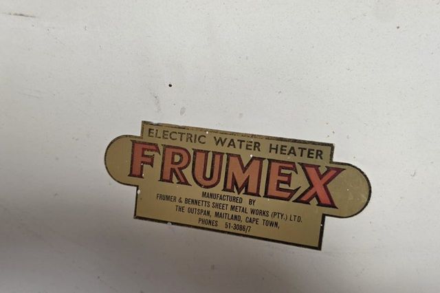 Badge on an old Frumex electric water heater made in Maitland, Cape Town