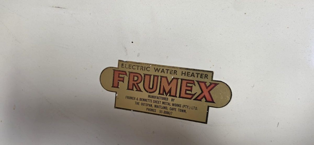 Badge on an old Frumex electric water heater, made by Frumer and Bennetts Sheet Metal Works in Maitland, Cape Town
